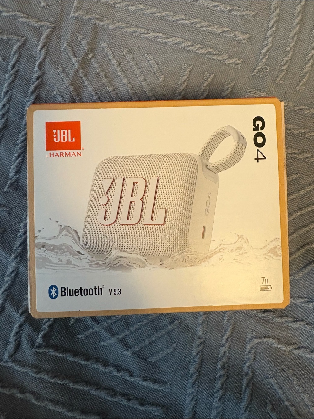 JBL GO 4 Portable Bluetooth Speaker — White with Coral Logo Accent